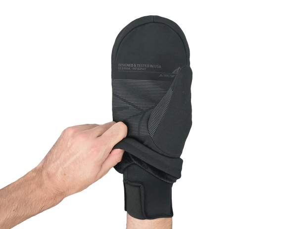 Black over mitt held up by a hand showing cuff of inner glove on a white background