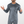 Man standing holding his arms out wearing mens grey reflective base layer top and bottoms